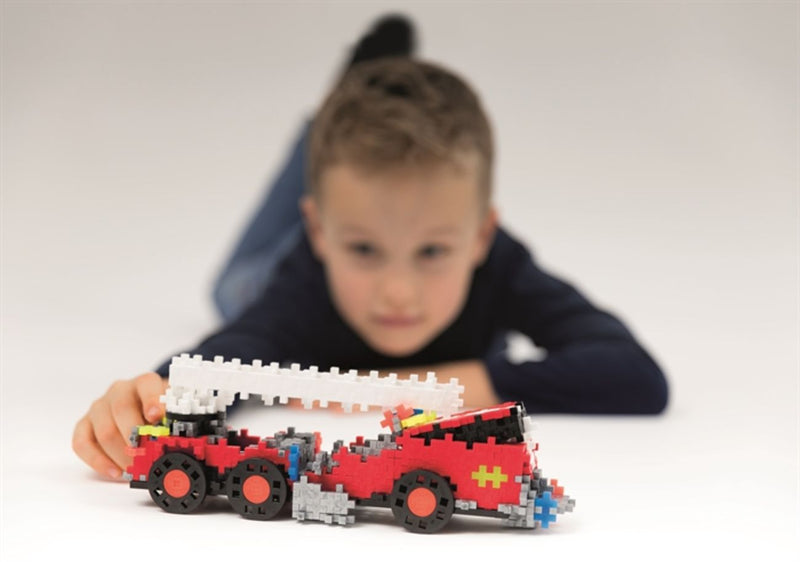 Boy Playing With Fire Engine - Plus Plus 500 Piece Go! Fire and Rescue Build Set - 7009