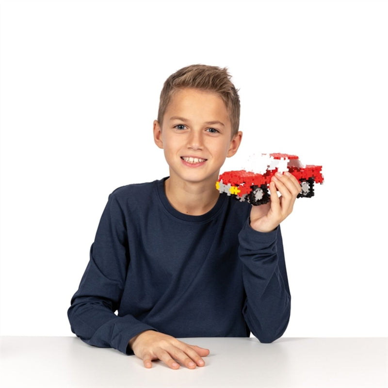 Boy Holding Car Build Option - Plus Plus 100 Piece Basic Superhero Build Set - 4106